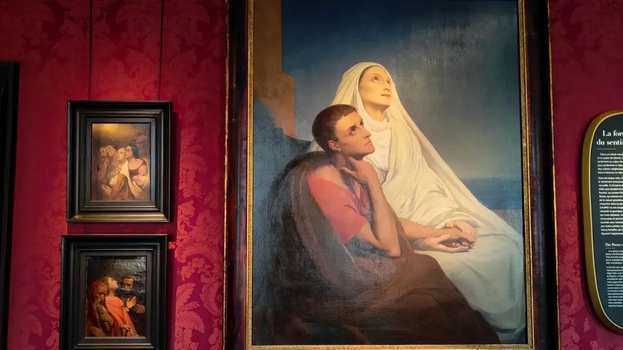 Gemälde von Ary Scheffer: Eine Frau in Weiß und ein Mann in Rot blicken hoffnungsvoll nach oben.