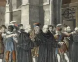 Martin Luther, in Mönchskutte, wird von einer Menge umringt, während ein Mann seine Thesen an eine Tür nagelt.