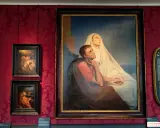 Gemälde von Ary Scheffer: Eine Frau in Weiß und ein Mann in Rot blicken hoffnungsvoll nach oben.