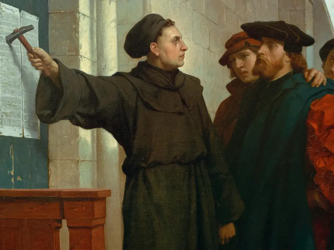 Martin Luther nagelt die 5 wichtigsten Thesen an die Kirchentür.
